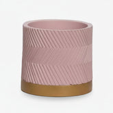 Groovy Rose Matte Cachepot with a golden base in front of a white background