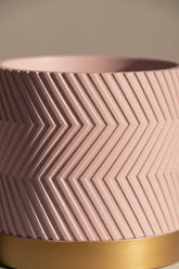 close-up of the details and patterns of the matte pink groovy decorative pot